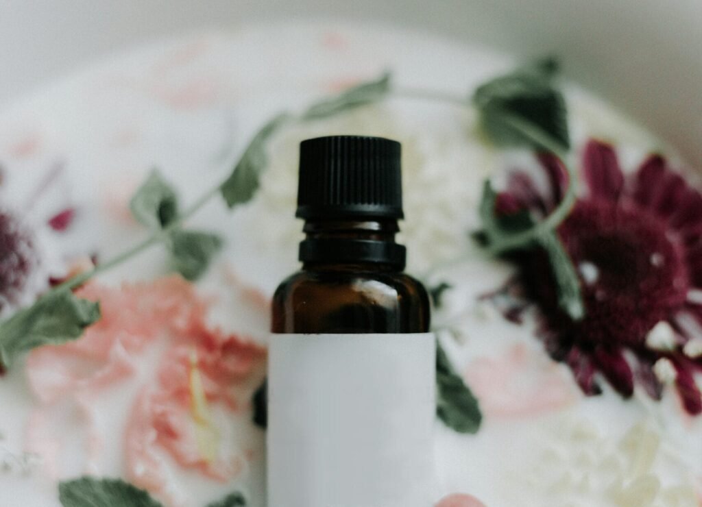 white and black glass bottle